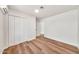 Bright bedroom features sleek hardwood floors and spacious closet at 4601 E Carolina Dr, Phoenix, AZ 85032