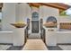 Up close view of the home's entryway, highlighting the address and beautiful decorative gate at 4601 E Carolina Dr, Phoenix, AZ 85032