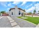 Beautiful home features a well-maintained front yard, a charming walkway, and an inviting entrance at 4601 E Carolina Dr, Phoenix, AZ 85032