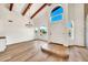 Bright foyer with arched windows and beautiful light wood-look floors at 4601 E Carolina Dr, Phoenix, AZ 85032