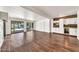 Spacious living room with wood floors, slider door to backyard and built in wet bar at 4601 E Carolina Dr, Phoenix, AZ 85032