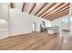 Bright living room and kitchen with vaulted ceilings and wood beams at 4601 E Carolina Dr, Phoenix, AZ 85032