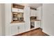 Stylish wet bar features custom cabinets, ample counter space, and beverage cooler at 4601 E Carolina Dr, Phoenix, AZ 85032