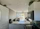 Bright and airy kitchen featuring white cabinets and appliances and an open living area at 4610 N 68 N St # 476, Scottsdale, AZ 85251