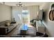 Bright living room with a balcony, a modern lighting fixture, and stylish decor at 4610 N 68 N St # 476, Scottsdale, AZ 85251