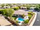 Enjoy a backyard oasis with a sparkling pool, lush landscaping, mature trees, and ample patio space for entertaining at 4618 W Pokeberry Ln, Phoenix, AZ 85083