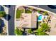 Backyard oasis with a sparkling pool, ample patio space, lush landscaping, and a desert view beyond at 4618 W Pokeberry Ln, Phoenix, AZ 85083