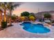Beautiful backyard with a sparkling pool, mature landscaping, and mountain views at 4618 W Pokeberry Ln, Phoenix, AZ 85083