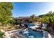 Luxurious backyard featuring a sparkling pool, relaxing spa, and elegant patio perfect for entertaining at 4618 W Pokeberry Ln, Phoenix, AZ 85083