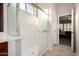 Bright bathroom showcasing glass-enclosed shower with tile flooring and view to connected bedroom at 4618 W Pokeberry Ln, Phoenix, AZ 85083