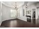 Bright dining room featuring hardwood floors and shuttered windows providing ample natural light at 4618 W Pokeberry Ln, Phoenix, AZ 85083