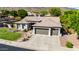 A beautiful single-story home with a well-manicured lawn, desert landscaping, and a convenient three-car garage at 4618 W Pokeberry Ln, Phoenix, AZ 85083
