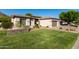 Charming single-story home with well-manicured lawn, stone accents, and a convenient two-car garage at 4618 W Pokeberry Ln, Phoenix, AZ 85083