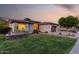 Charming single-story home with well-manicured lawn, stone accents, and a convenient two-car garage at 4618 W Pokeberry Ln, Phoenix, AZ 85083