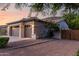 Spacious three-car garage offers ample parking and storage, complemented by a private driveway at 4618 W Pokeberry Ln, Phoenix, AZ 85083