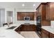 Spacious kitchen boasting dark cabinetry, stainless steel appliances, and ample counter space at 4618 W Pokeberry Ln, Phoenix, AZ 85083
