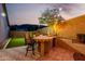 Outdoor kitchen features a built-in grill, bar seating, and lush landscaping, perfect for al fresco dining at 4618 W Pokeberry Ln, Phoenix, AZ 85083