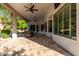 Bright and airy covered patio with tile flooring and ample space for outdoor seating at 4618 W Pokeberry Ln, Phoenix, AZ 85083