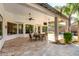 Spacious covered patio features ceiling fans, tile flooring, and ample seating area at 4618 W Pokeberry Ln, Phoenix, AZ 85083