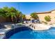 Inviting pool area with raised spa, water features, and lush greenery, perfect for relaxation at 4618 W Pokeberry Ln, Phoenix, AZ 85083