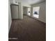 Carpeted bedroom features mirrored closet doors and natural light at 5035 N 10Th Pl # 109, Phoenix, AZ 85014