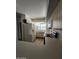 Well-lit kitchen with white appliances, ample counter space, and breakfast bar at 5035 N 10Th Pl # 109, Phoenix, AZ 85014
