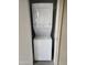 A stacked, white washer and dryer set are neatly placed in a dedicated laundry area at 5035 N 10Th Pl # 109, Phoenix, AZ 85014