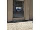 View of a WestUSA real estate sign posted in a window on a stucco building at 5035 N 10Th Pl # 109, Phoenix, AZ 85014