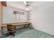 Bedroom with a ceiling fan, window, and built-in desk with shelving at 509 N Hobson Plz, Mesa, AZ 85203