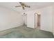 Spacious bedroom featuring a ceiling fan and doorway leading to the bathroom at 509 N Hobson Plz, Mesa, AZ 85203