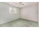 Bedroom featuring a ceiling fan, a window with blinds, and green carpeting at 509 N Hobson Plz, Mesa, AZ 85203