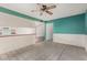 Inviting dining space with tile floors and a ceiling fan, seamlessly connected to the adjacent kitchen area at 509 N Hobson Plz, Mesa, AZ 85203