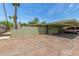 Side view of building with covered parking, secure entrance, and desert landscaping at 509 N Hobson Plz, Mesa, AZ 85203