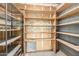 Spacious storage room featuring extensive shelving, ideal for organizing and storing household items at 509 N Hobson Plz, Mesa, AZ 85203