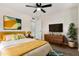 Inviting bedroom with modern touches, a ceiling fan, and comfortable furnishings at 556 S Forest --, Mesa, AZ 85204
