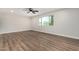 Bright bedroom featuring hardwood floors, a ceiling fan, and natural light from a window at 556 S Forest --, Mesa, AZ 85204