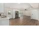 Open kitchen features modern appliances, white cabinets, and hardwood flooring at 556 S Forest --, Mesa, AZ 85204