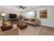 Inviting living room with ample seating, warm wood accents, and a large window at 556 S Forest --, Mesa, AZ 85204