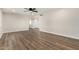 Large living room showcasing hardwood flooring, ceiling fan, and a view to the entry at 556 S Forest --, Mesa, AZ 85204