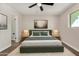 Stylish bedroom featuring modern decor, a ceiling fan, and warm, inviting lighting at 556 S Forest --, Mesa, AZ 85204