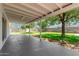 Covered patio overlooking spacious green backyard, ideal for outdoor entertaining at 556 S Forest --, Mesa, AZ 85204