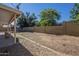 Large backyard with block wall, gravel, and a trampoline for outdoor fun at 7930 W Colter St, Glendale, AZ 85303