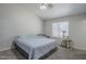 Cozy bedroom with neutral walls, carpet flooring, and a large window for natural light at 7930 W Colter St, Glendale, AZ 85303