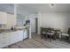 Open-concept kitchen and dining area featuring granite countertops, hardwood floors, and a dining set at 7930 W Colter St, Glendale, AZ 85303