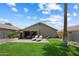 Expansive backyard with lush lawn, covered patio, and lounge chairs, ideal for outdoor enjoyment at 810 E Potter Dr, Phoenix, AZ 85024