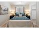 Well-lit bedroom featuring a comfortable bed, soft lighting, and calming decor at 810 E Potter Dr, Phoenix, AZ 85024