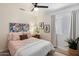 Inviting bedroom with a cozy bed, side tables, and decorative artwork at 810 E Potter Dr, Phoenix, AZ 85024