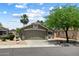 Charming single-story home featuring a neutral color palette, desert landscaping, and a two-car garage at 810 E Potter Dr, Phoenix, AZ 85024