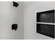 Close-up of the stylish shower with white subway tile and a sleek, built-in storage niche at 810 E Potter Dr, Phoenix, AZ 85024