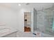 Bright bathroom features a large walk-in shower with marble tiling, a dual-sink vanity, and a view into the closet at 8102 E Cambridge Ave, Scottsdale, AZ 85257